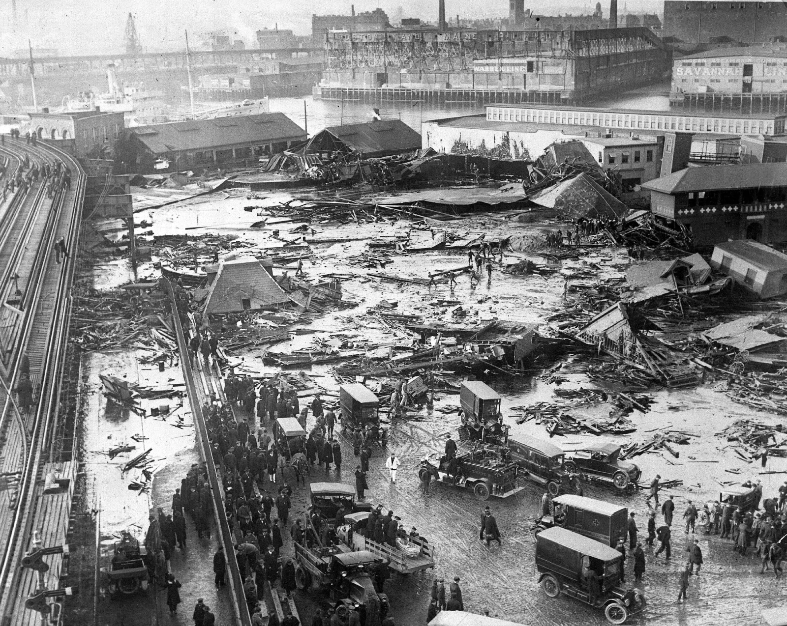 Crowds and wreckage at the site of the ruptured Purity Distilling tank after the Great Boston Molasses Flood, January 1919.