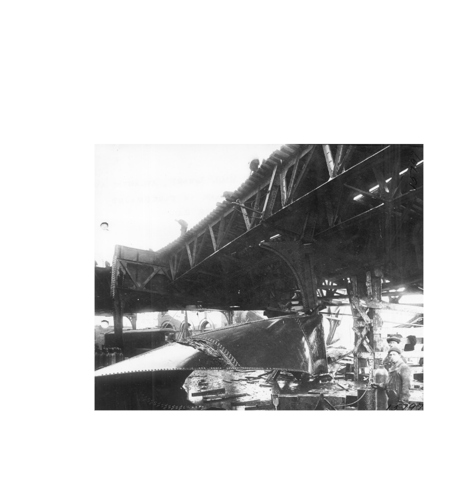 Wreckage and the buckled elevated railway structure on Commercial Street after the 1919 Boston molasses tank collapse.